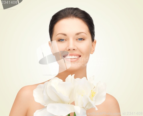 Image of lovely woman with orchid flower