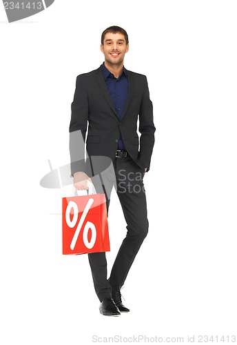 Image of handsome man in suit with shopping bags