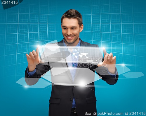 Image of man in suit working with virtual screens