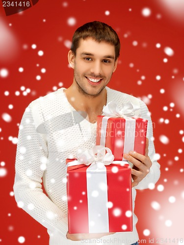 Image of man holding many gift boxes