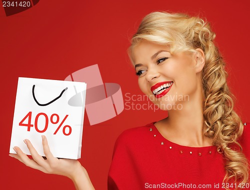 Image of lovely woman in red dress with shopping bag