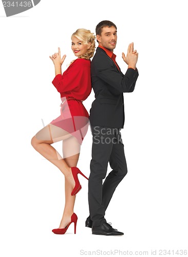 Image of man and woman making a gun gesture