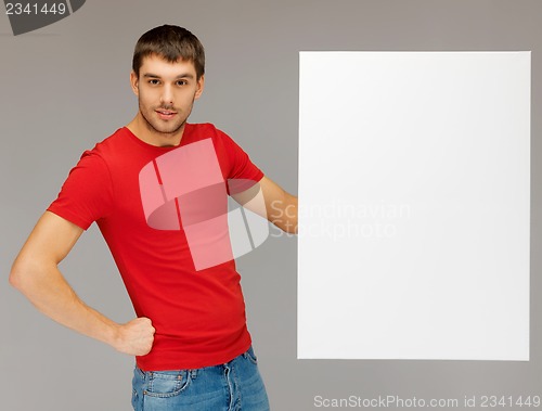 Image of handsome man with big blank board