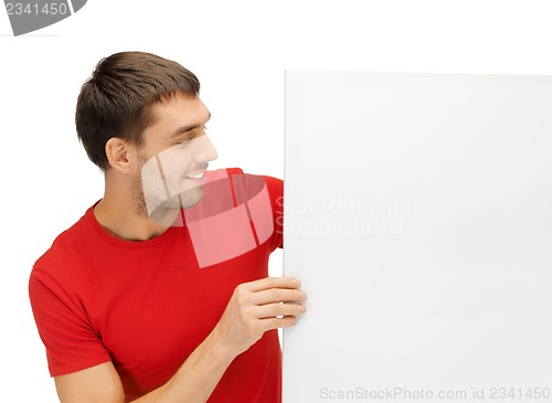 Image of handsome man with big blank board