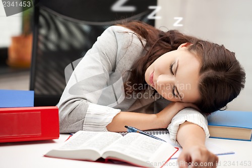 Image of sleeping woman with book