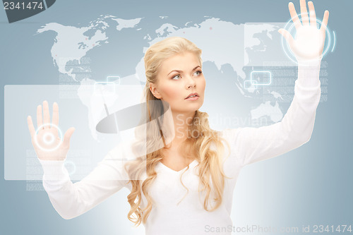 Image of businesswoman working with touch screen