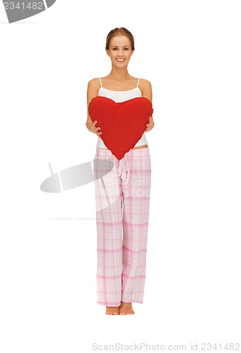 Image of woman in cotton pajamas with big heart