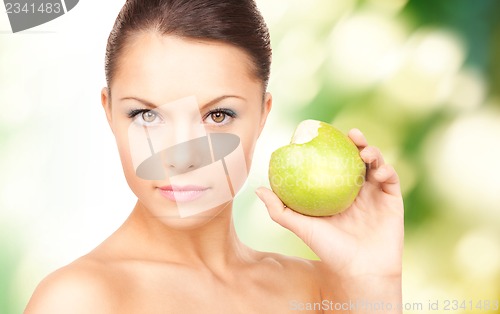 Image of young beautiful woman with green apple