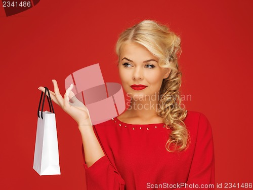 Image of lovely woman in red dress with shopping bag