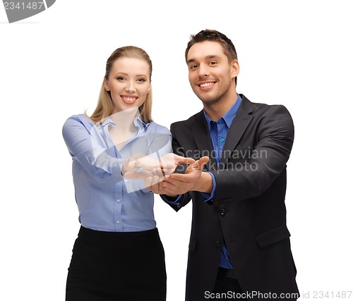 Image of man and woman showing something on the palms