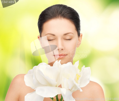 Image of lovely woman with orchid flower