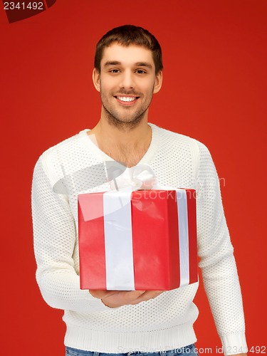 Image of handsome man with a gift