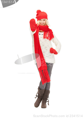 Image of beautiful woman in hat, muffler and mittens