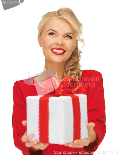 Image of lovely woman in red dress with present