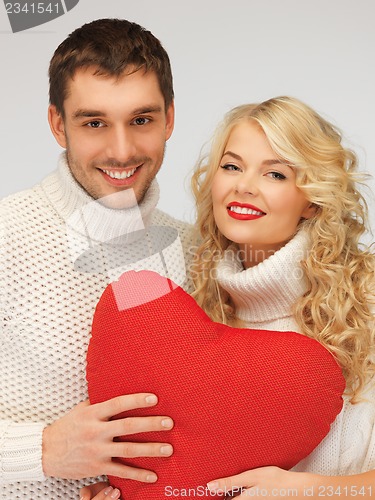 Image of family couple in a sweaters with heart