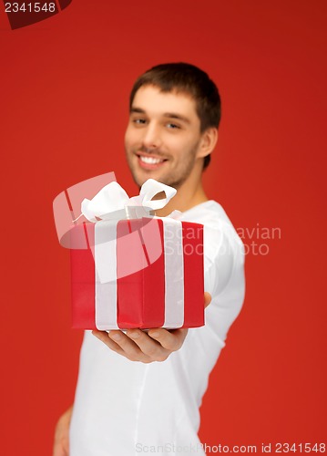 Image of handsome man with a gift