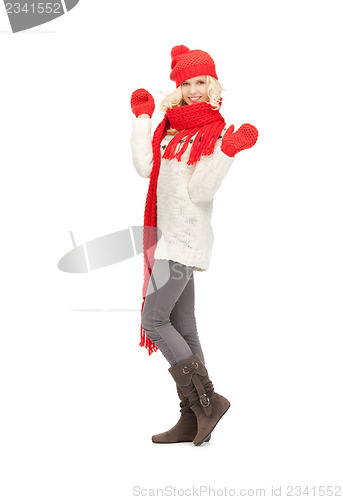 Image of beautiful woman in hat, muffler and mittens
