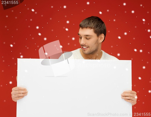Image of handsome man with big blank board