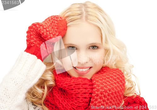Image of beautiful woman in mittens