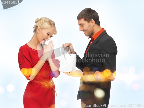 Image of man and woman with present