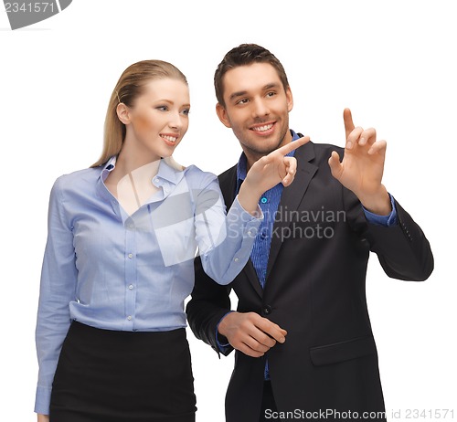 Image of man and woman working with something imaginary