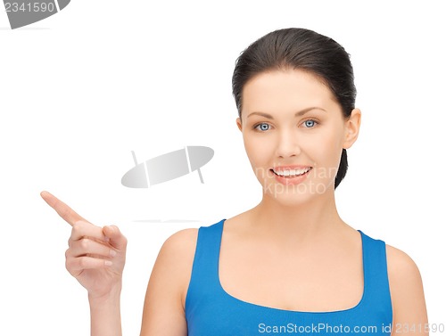 Image of beautiful woman pointing her finger