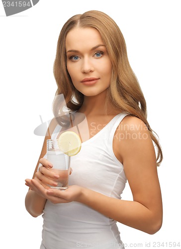 Image of woman with lemon slice on glass of water