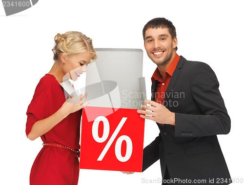 Image of man and woman with percent sign