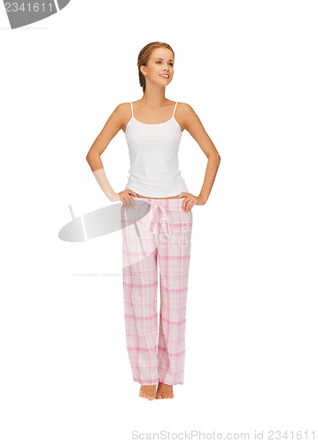 Image of happy and smiling woman in cotton pajamas