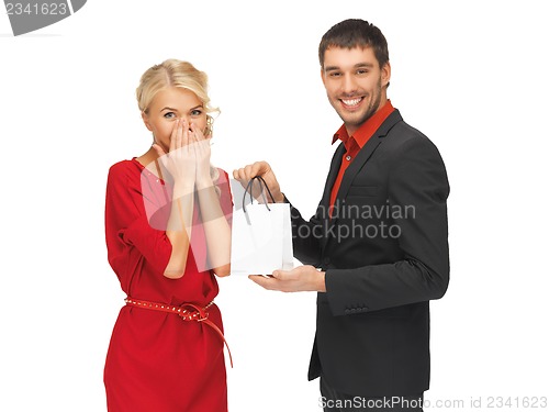 Image of man and woman with present