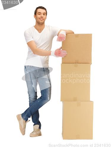 Image of handsome man with big boxes