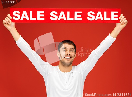 Image of handsome man with sale sign