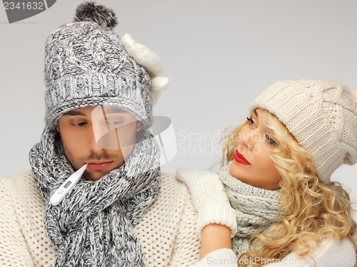 Image of family couple with thermometer