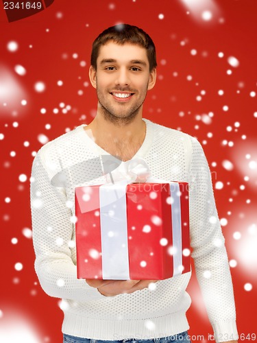 Image of handsome man with a gift