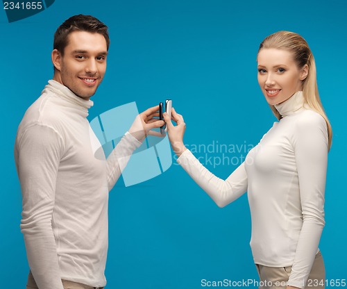 Image of man and woman with modern gadgets
