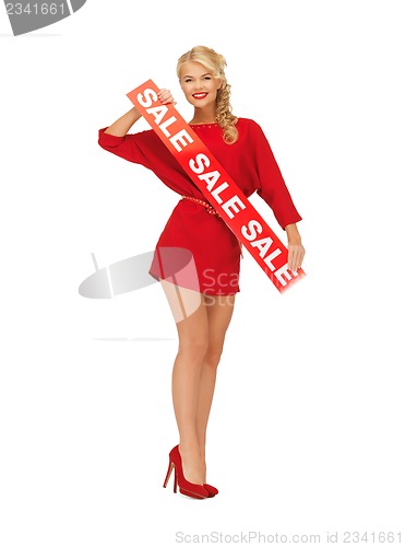 Image of lovely woman in red dress with sale sign