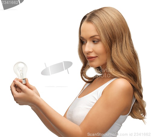 Image of woman with energy saving bulb