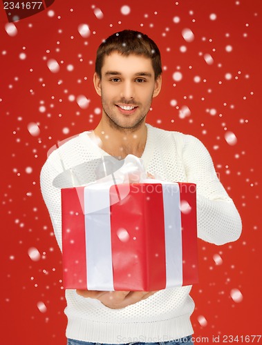 Image of handsome man with a gift