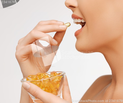 Image of woman with vitamins