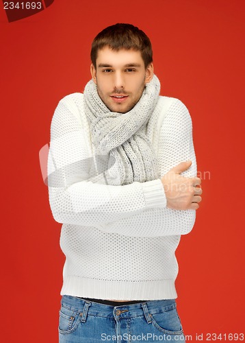 Image of handsome man in warm sweater and scarf