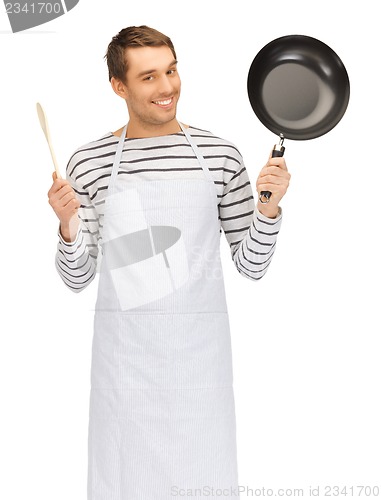 Image of handsome man with pan and spoon