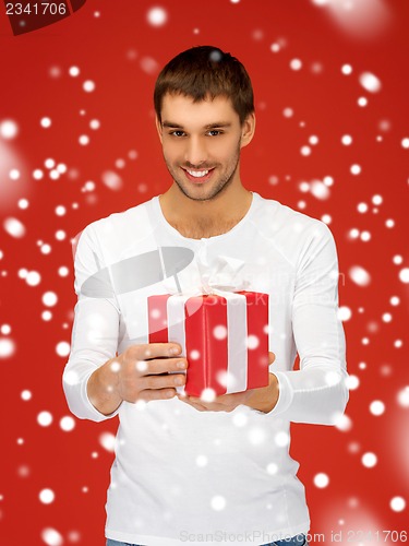 Image of handsome man with a gift