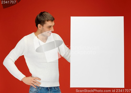 Image of handsome man with big blank board