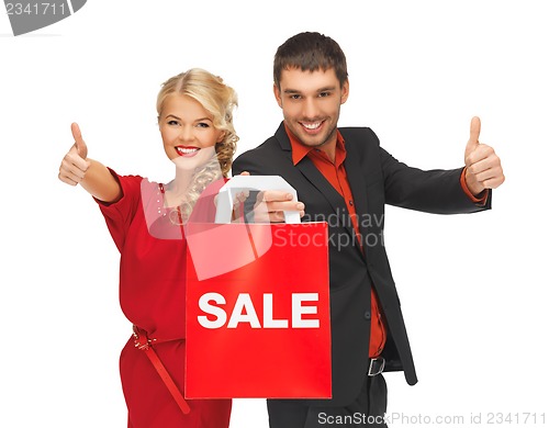 Image of man and woman with shopping bag