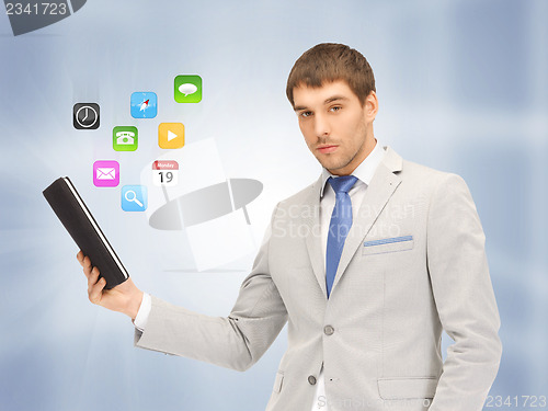 Image of calm man with tablet pc computer