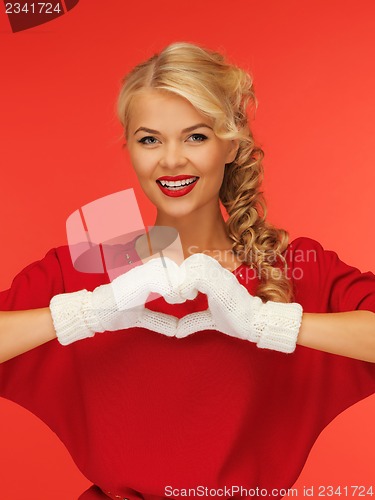 Image of lovely woman showing heart shape