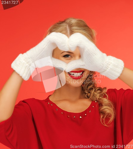 Image of lovely woman showing heart shape