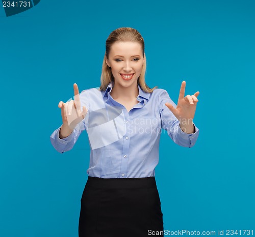 Image of woman working with something imaginary
