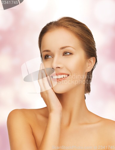 Image of face and hands of beautiful woman