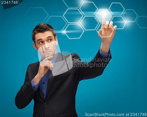 Image of man in suit working with virtual screens